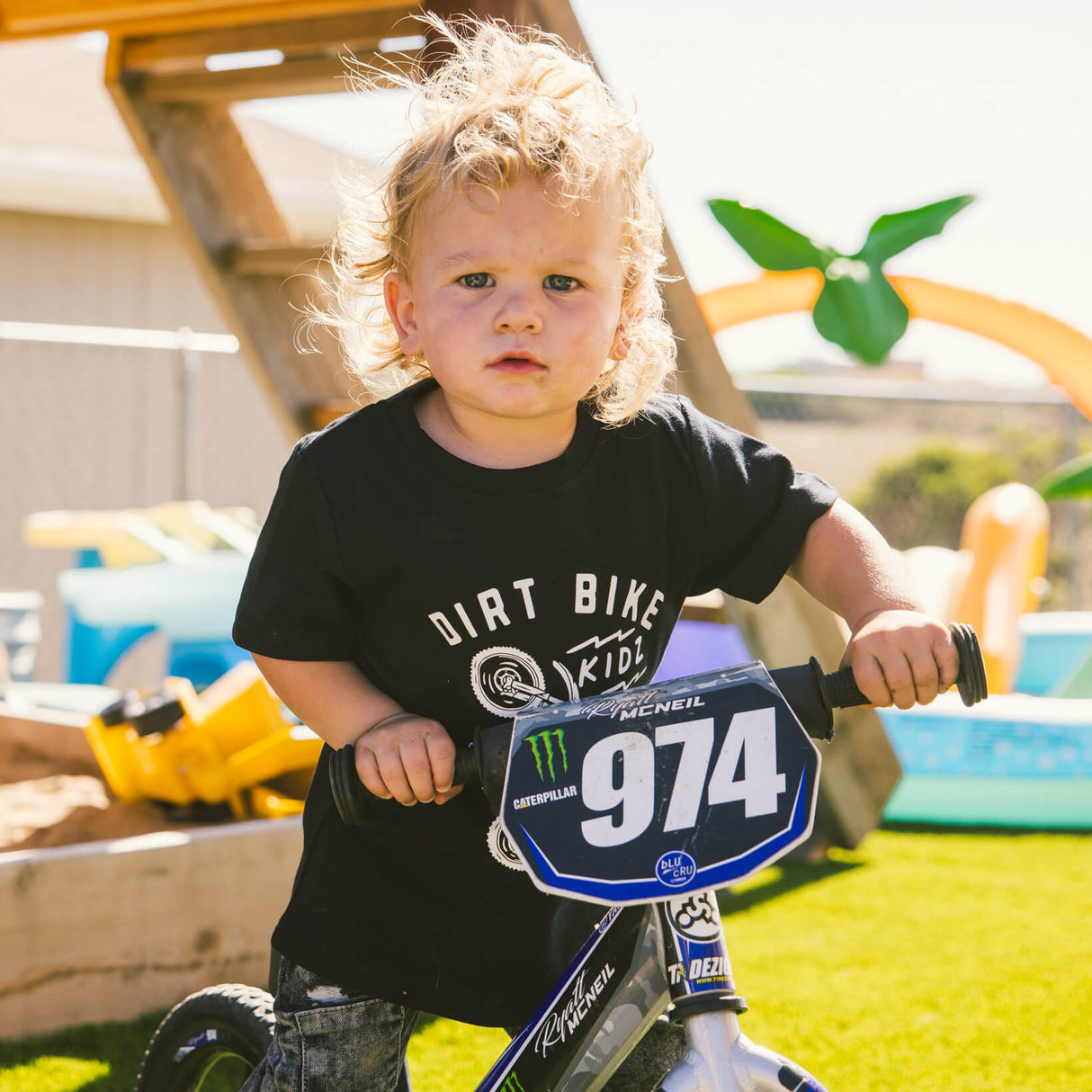Black toddler T-shirt with front bike rider graphic, child holding a motocross sign 974