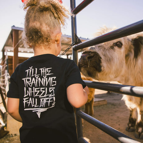 Black toddler T-shirt with large white back graphic and stacked lettering