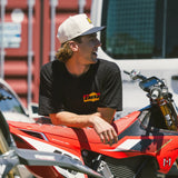 Black crewneck T-shirt with small DBK logo on the chest, worn by a rider