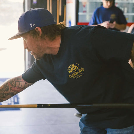 Gold Nugget Tee front in dark color with small DBK logo, short sleeves