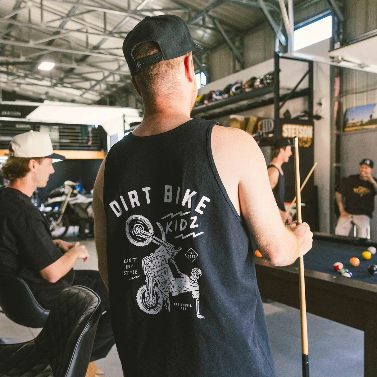 Black kids tank top back view with 'DIRT BIKE KIDZ' motorcycle print