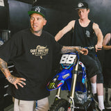 Black T-shirt worn with front dirt bike graphic logo