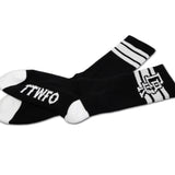 Black crew sock with white stripes, “TTWTF” lettering, and top graphic detail.