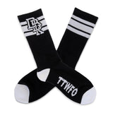 2-pack black crew socks with white stripes, top graphic, and “TTWTF” lettering at ankle.