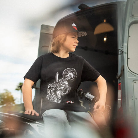Black youth premium tee with wheelie rider graphic on front