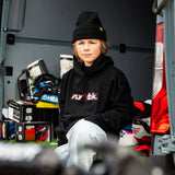 Youth black hoodie with FLY dbk logo, worn with light jeans