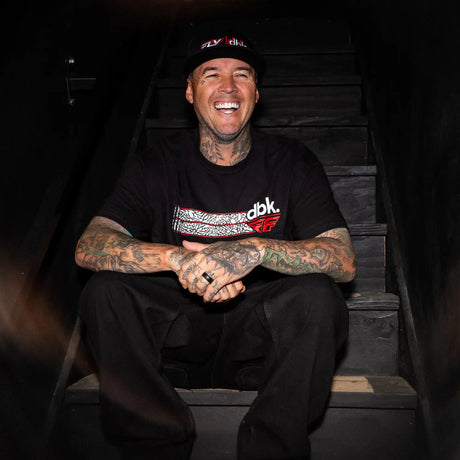 Black cap with red/white FLY|dbk logo, worn