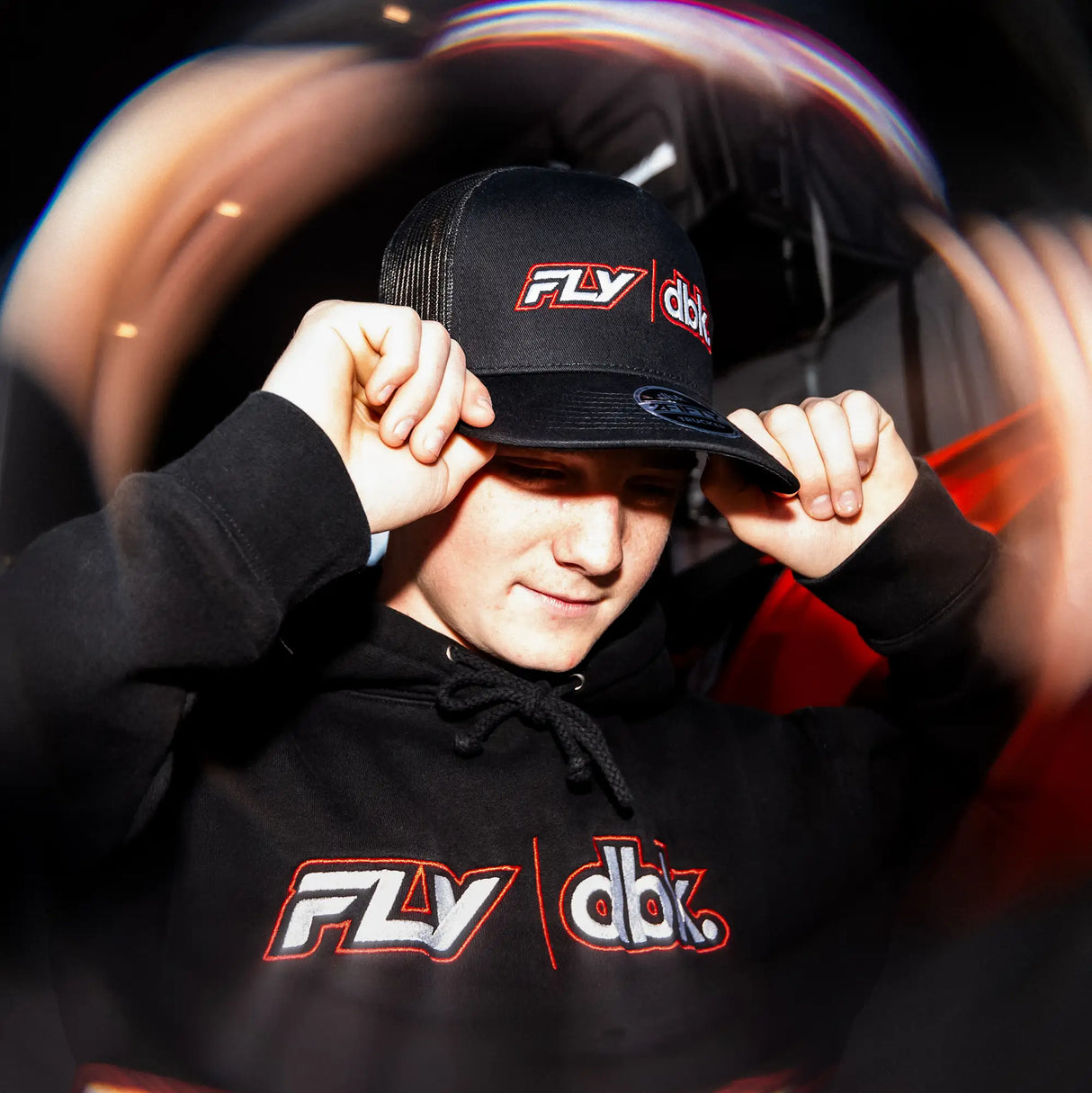 Black trucker cap with FLY and dbk logos on side