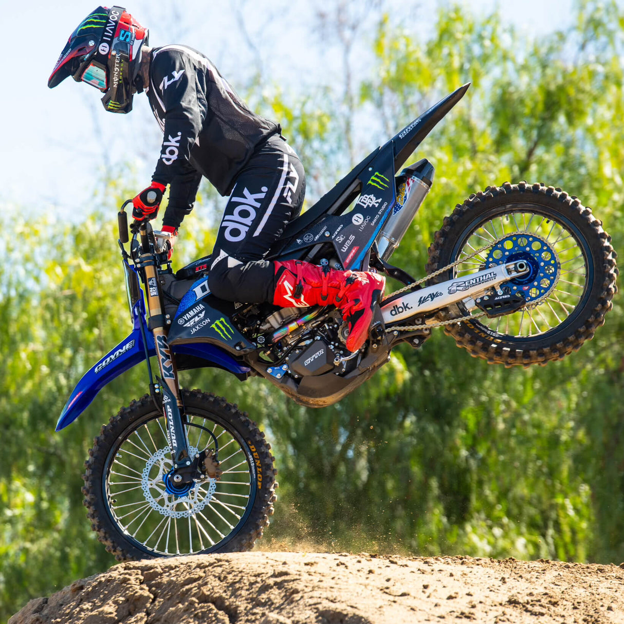 Black riding pants with white vertical stripe and dbk logo on the leg