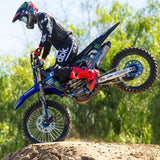 Black riding pants with white vertical stripe and dbk logo on the leg
