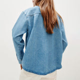 Burnout oversized denim shirt back view, light blue with straight hem and buttoned cuffs