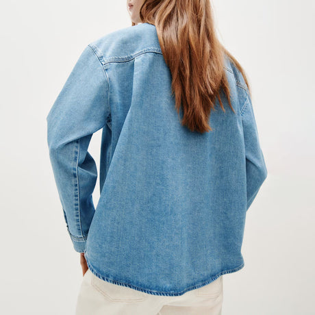 Burnout oversized denim shirt back view, light blue with straight hem and buttoned cuffs