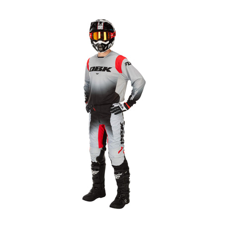 Kinetic DBK jersey with gray body, red accents, and black logo panel