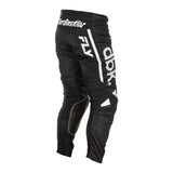 Black motocross pants close-up with white logo stripe and protective knee padding
