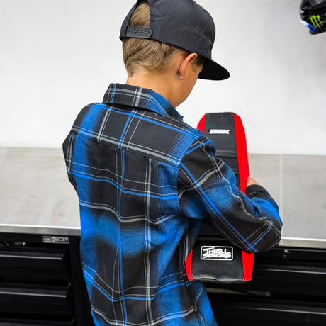 Youth flannel plaid shirt back view in blue and black with contrast panel details