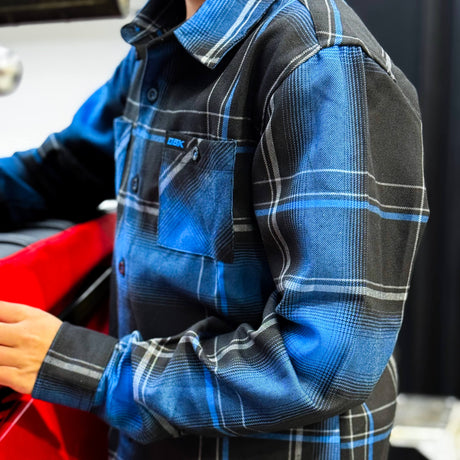 Youth flannel shirt with blue and black plaid, button front and chest pocket