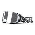 Helios goggle with white frame, dark mirrored lens, and black-and-white graphic strap