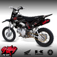 Pit bike with black and red graphics, knobby tires, front-left three-quarter view