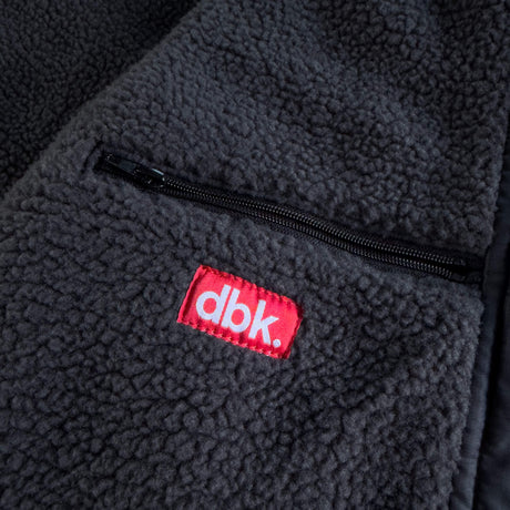 Fleece-lined interior pocket with dbk logo label and black zipper