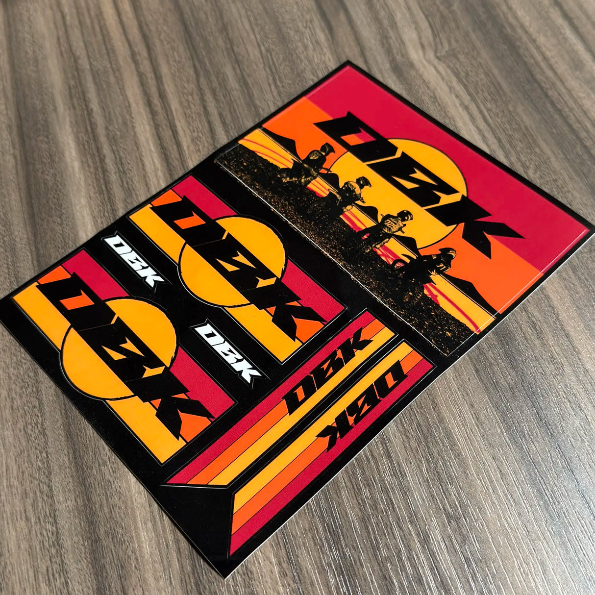 Set of D2K sticker decals with large logo, rider scene, and orange stripe designs