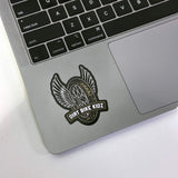 Single winged dirt bike logo sticker with DIRT BIKE KIDZ text on a laptop surface