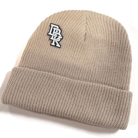 Tan ribbed beanie with logo patch on top front