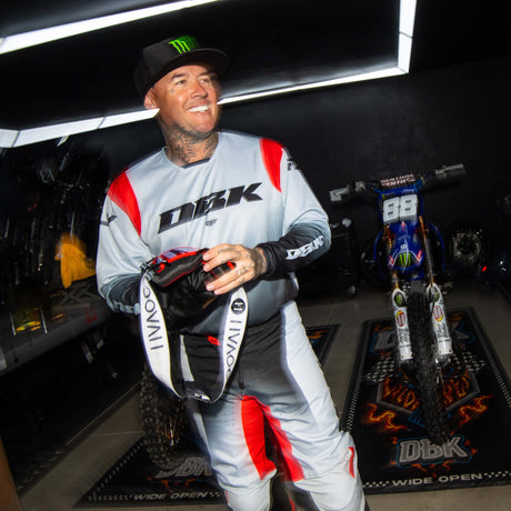 Motocross jersey in light gray and black with red paneling on sleeves and DBK chest logo