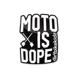 Die-cut sticker reading 'MOTO IS DOPE' with crossbones and vertical script text