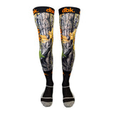 Pair of moto socks with gray camo print, yellow accents, green detail, black toe and heel