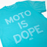 Women’s graphic T-shirt in teal with large white “Moto is Dope” text print on chest.