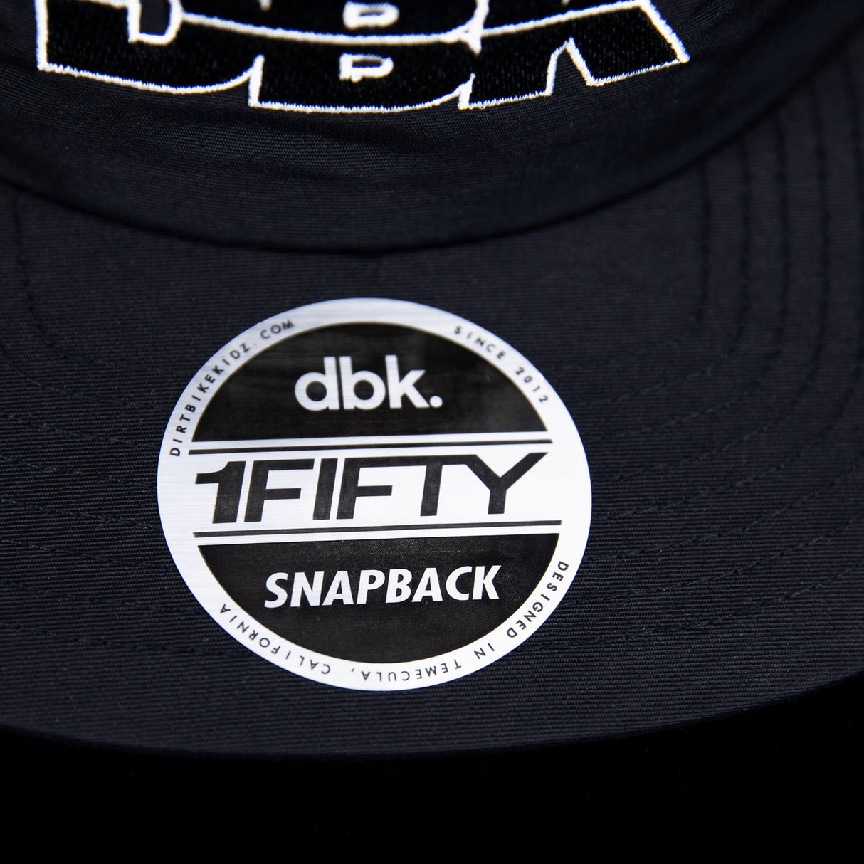 1FIFTY snapback logo patch on the brim of a black cap.