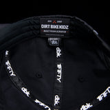 Black cap interior with Dirt Bike Kidz label and stitched panel seams.