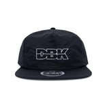 Black snapback cap with DBK logo graphic on the front panel, studio view.
