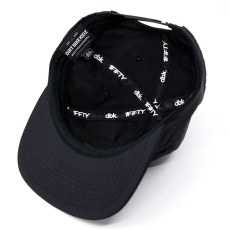 Black snapback cap interior showing printed logos and adjustable strap.