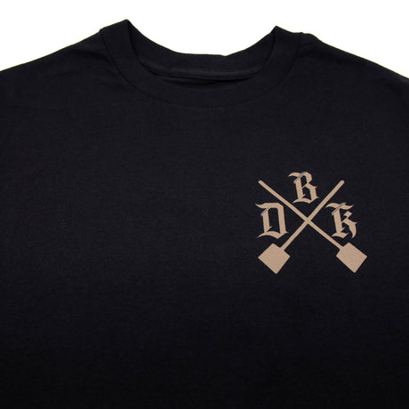 Black men's graphic T-shirt front close-up of crossed-shovel emblem logo