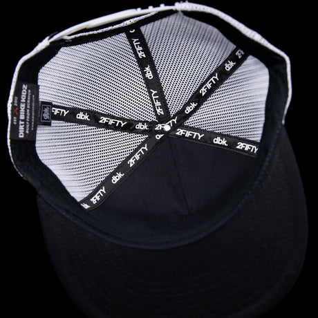 Black trucker hat interior lining with 2FIFTY and dbk printed bands.