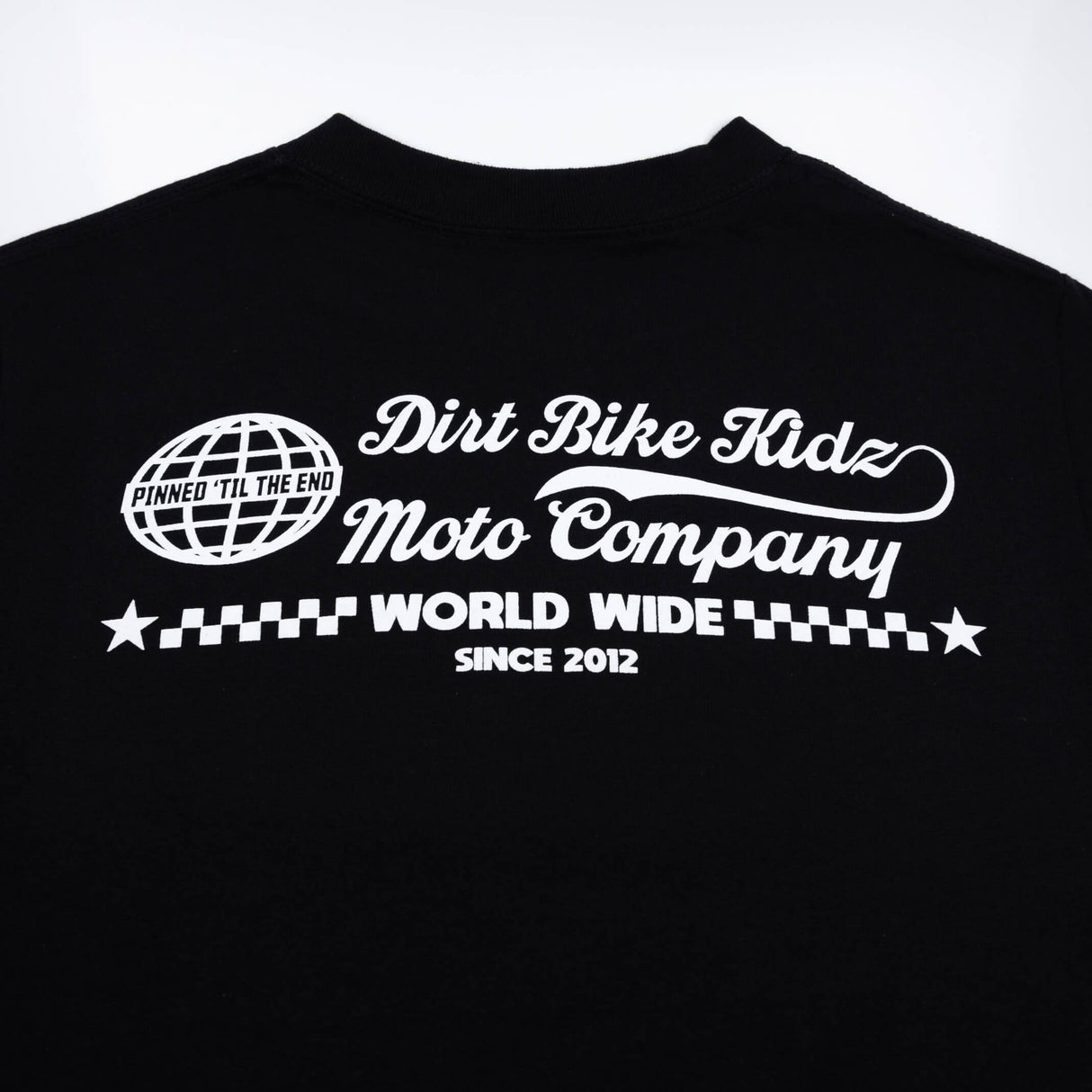 Black T-shirt front graphic: Dirt Bike Kidz Moto Company with World Wide and stars