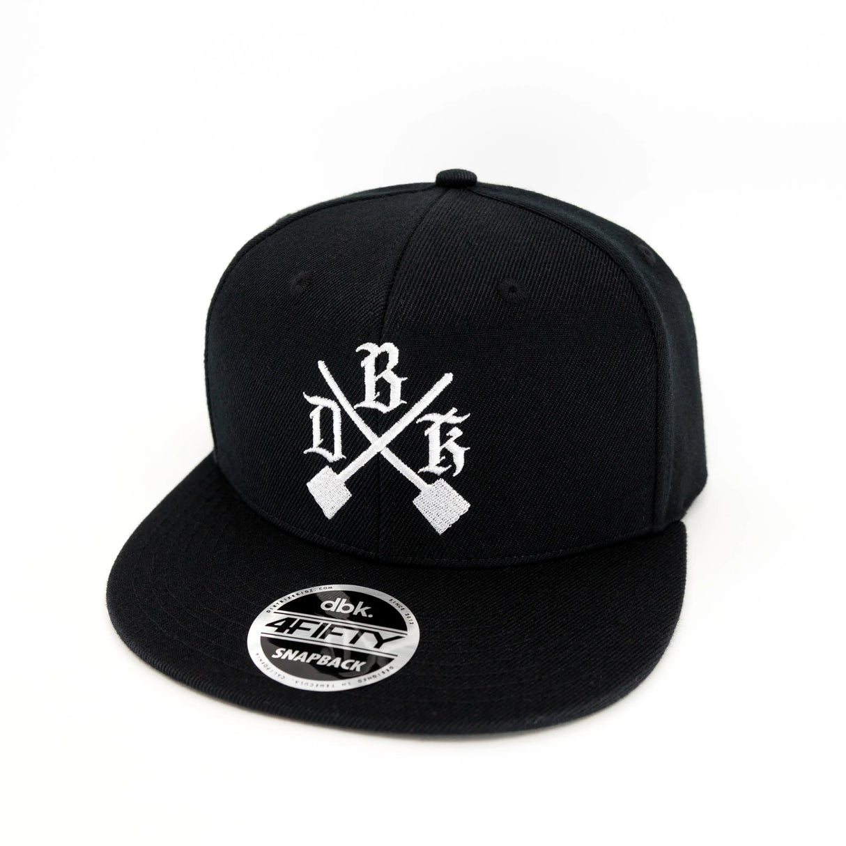 Black snapback back with white cross logo and circular side brand patch