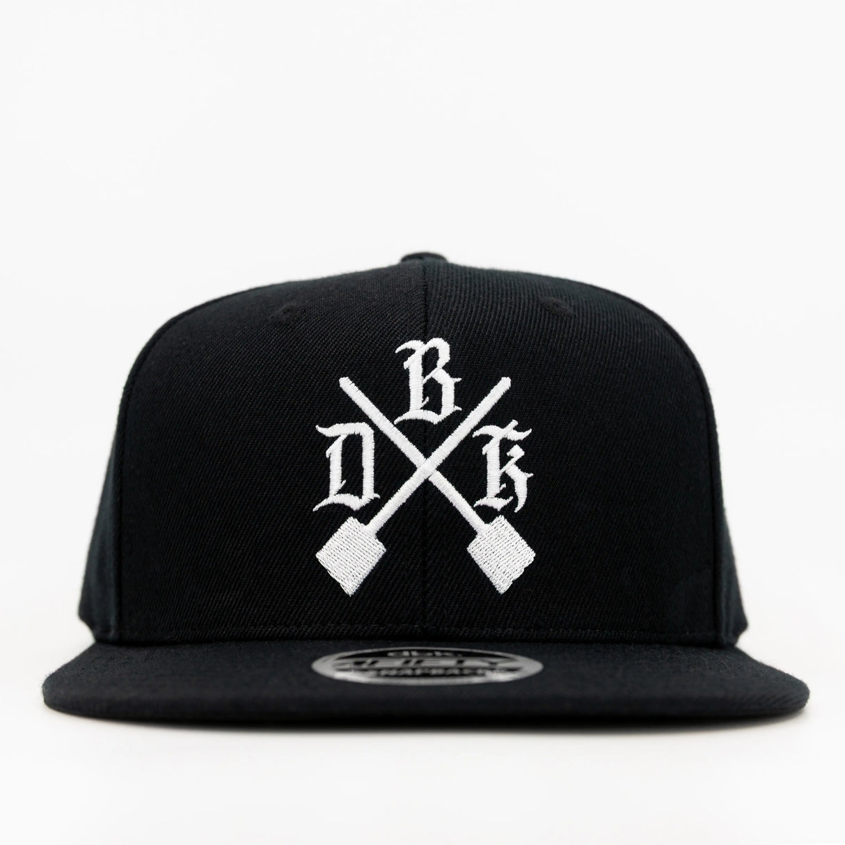 Black snapback with white cross-design graphic and flat brim
