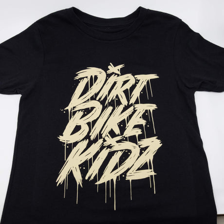 Black youth tee close-up with centered beige DRRT BIKE RIDE graphic print.