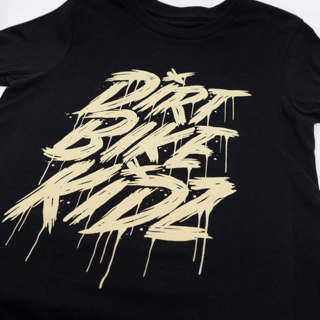 Black youth tee close-up of beige DRRT BIKE RIDE graphic with drips.