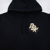 Black hoodie hood drawstrings with small gold logo graphic on front