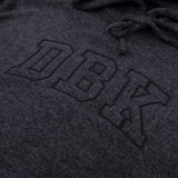 Women’s dark charcoal pullover hoodie close-up of logo graphic and hood drawstrings