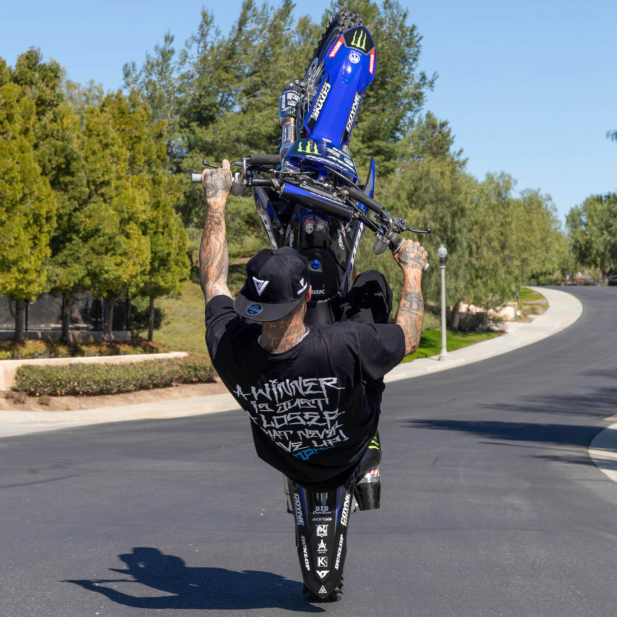 Black T-shirt with large white back graphic and blue logo