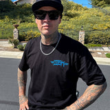 Black T-shirt with small blue chest logo on the front