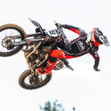 Youth kinetic motocross jersey, black with red sleeves and contrast trim, long sleeves