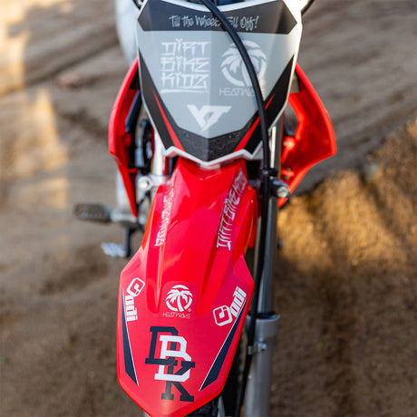 Motorcycle front fairing panel with red, black, and white graphic decals