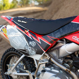 Motorcycle seat and side fairing with black fabric and red/white graphic designs