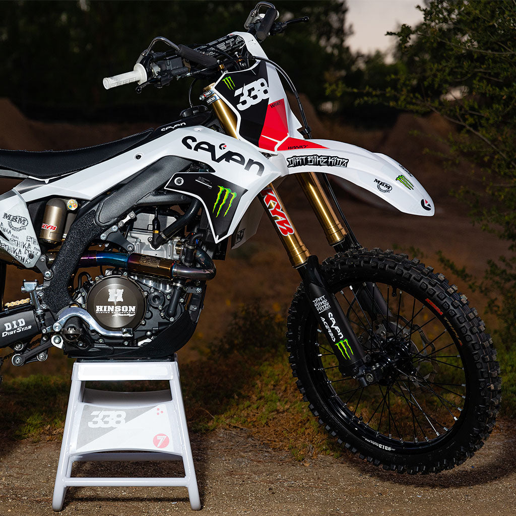 Graffiti-style die-cut stickers applied to a motorcycle side fender