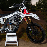 Graffiti-style die-cut stickers applied to a motorcycle side fender